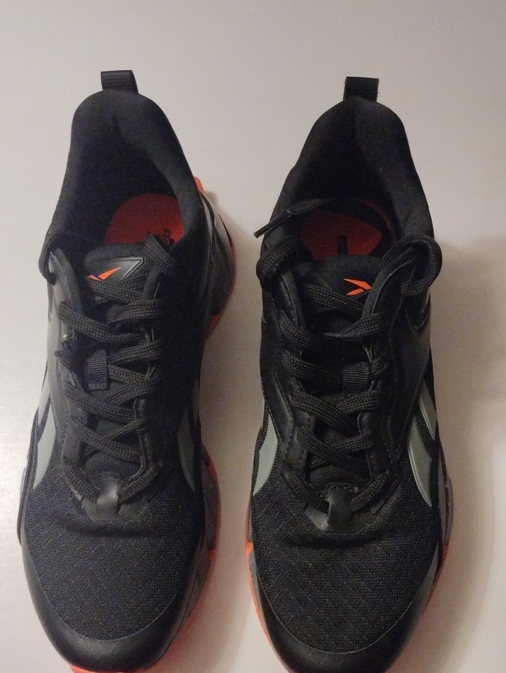 Reebok Black Athletic Sneakers with Orange Accents